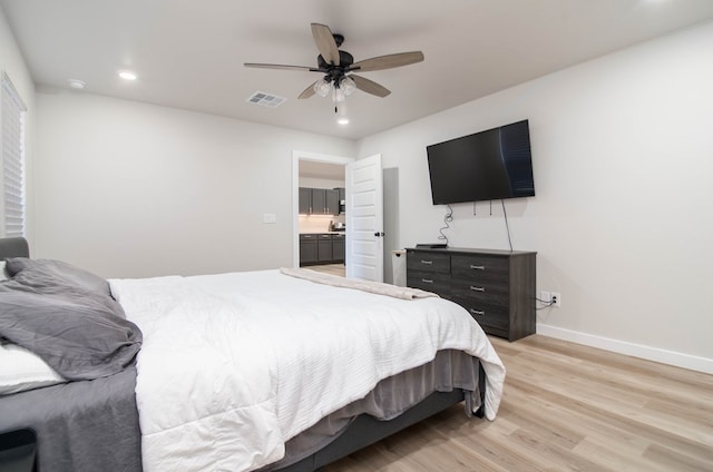 bedroom featuring light wood-style floors, baseboards, recessed lighting, and ceiling fan