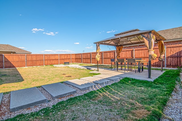 view of yard featuring a gazebo and a patio