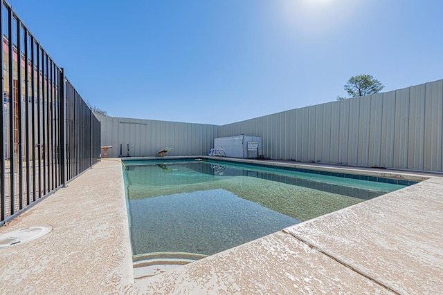 view of swimming pool with fence and a fenced in pool