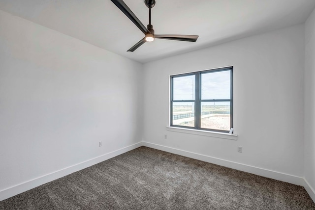 spare room featuring ceiling fan and carpet floors