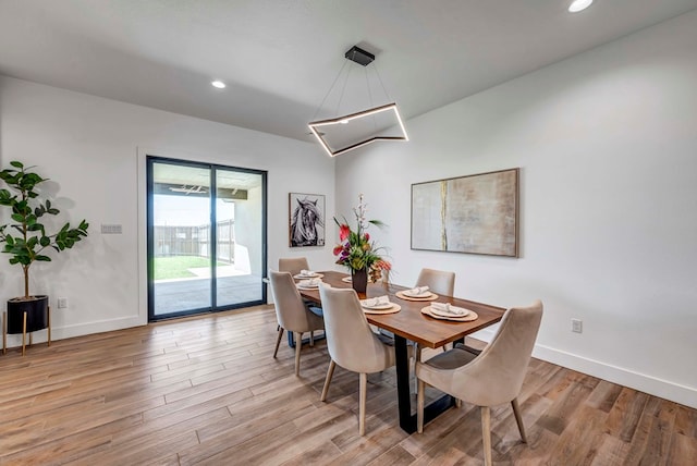 dining area with light hardwood / wood-style floors