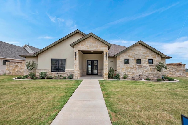 view of front of house featuring french doors and a front yard