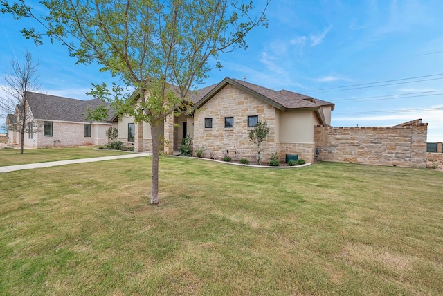 view of front of home with a front lawn