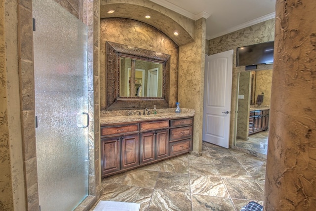 bathroom with walk in shower, ornamental molding, and vanity