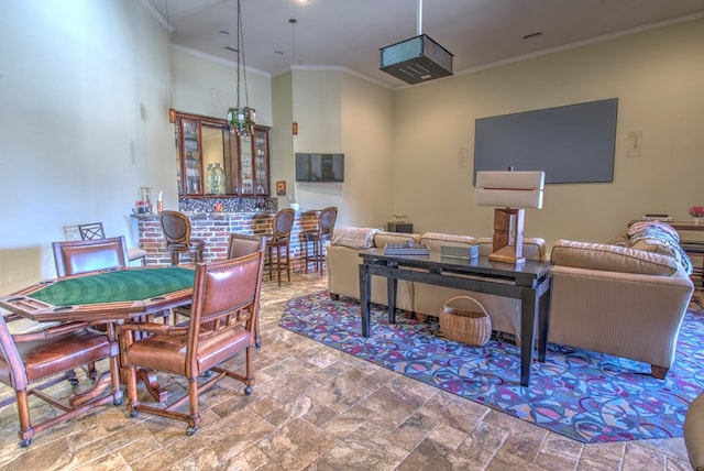 dining space featuring crown molding