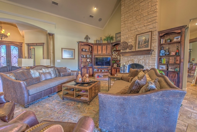 living room with ornamental molding, a fireplace, high vaulted ceiling, and french doors