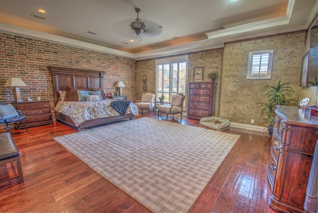 bedroom with dark hardwood / wood-style flooring and crown molding