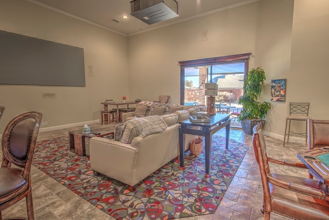 living room featuring a high ceiling and crown molding