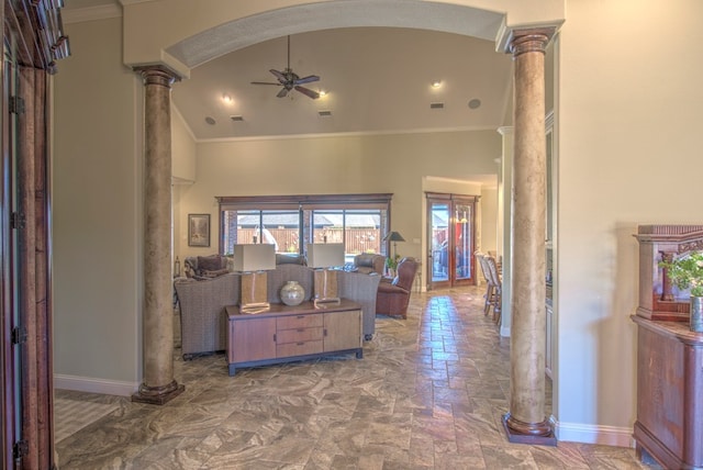 interior space featuring high vaulted ceiling, ornamental molding, decorative columns, and ceiling fan