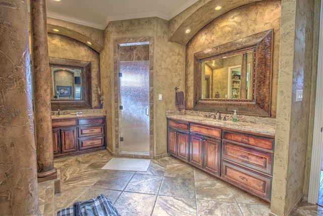 bathroom featuring vanity, crown molding, and walk in shower