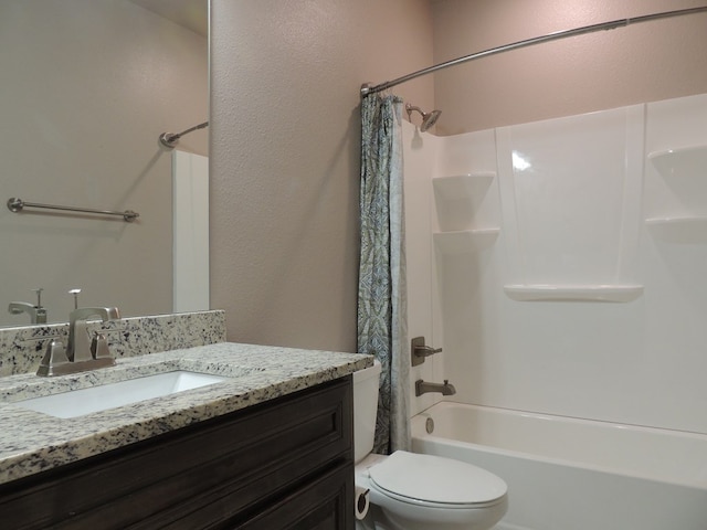 full bathroom featuring shower / tub combo with curtain, vanity, and toilet