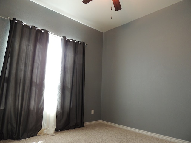 spare room with carpet, ceiling fan, and lofted ceiling