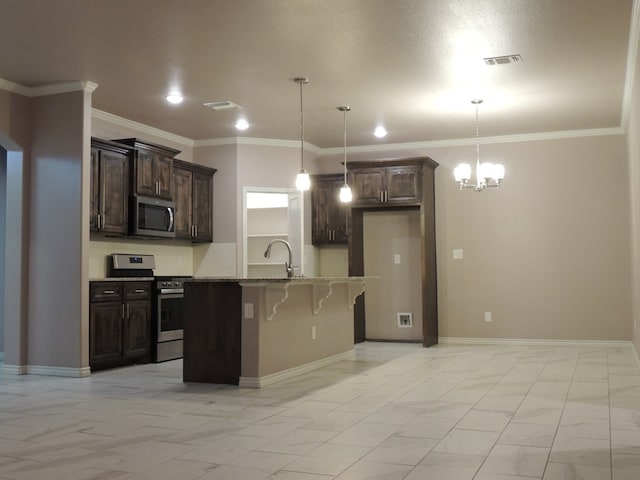 kitchen with light stone countertops, stainless steel appliances, decorative light fixtures, dark brown cabinets, and a center island with sink