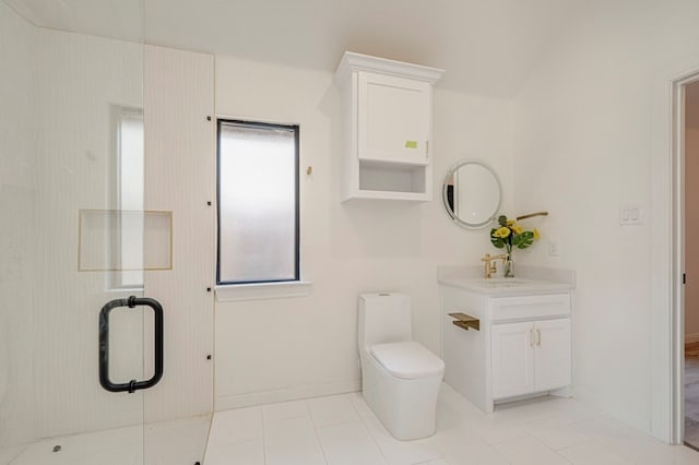 bathroom featuring vanity, a shower with door, and toilet