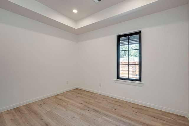 unfurnished room with light wood-type flooring