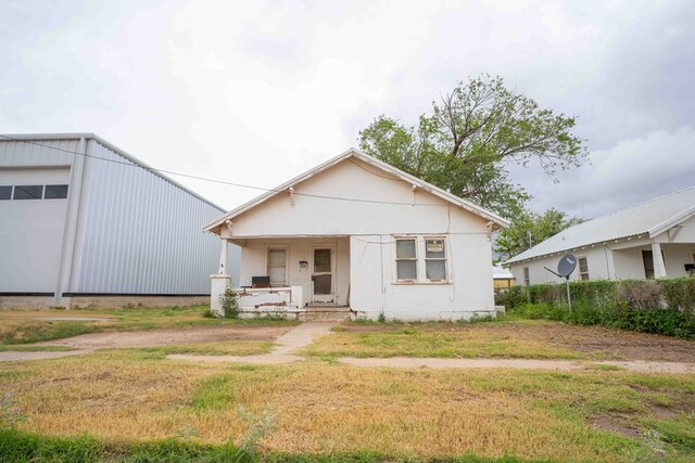 206 Austin, Big Spring, TX 79720 - view of front of property with a porch and a front yard