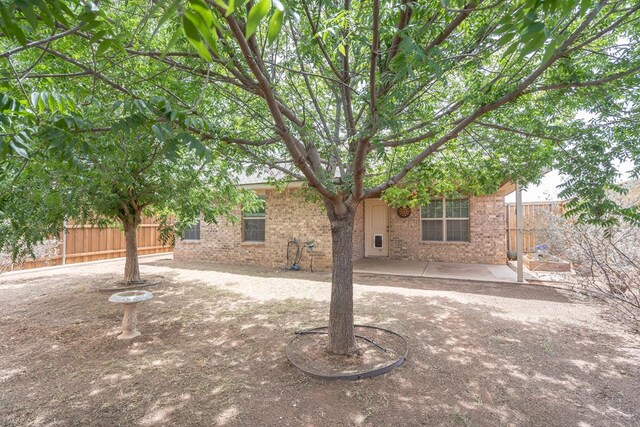 802 Wagner, Midland, TX 79707 - view of front of property featuring fence, a patio, and brick siding