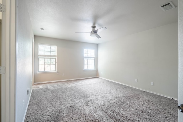 802 Wagner, Midland, TX 79707 - empty room with a ceiling fan, plenty of natural light, carpet, and baseboards