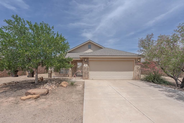 802 Wagner, Midland, TX 79707 - view of front of house featuring concrete driveway, a garage, a shingled roof, and brick siding
