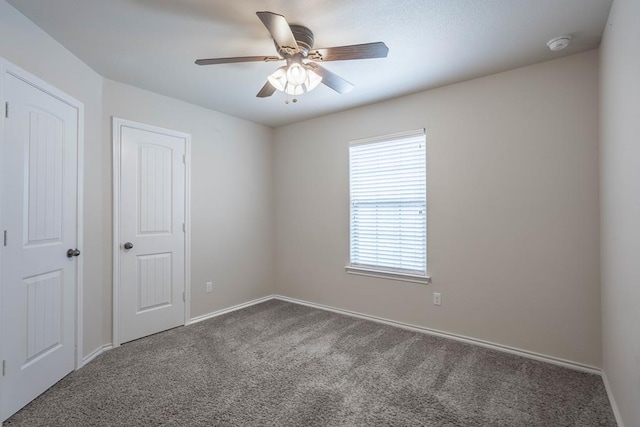 802 Wagner, Midland, TX 79707 - empty room featuring carpet flooring, a ceiling fan, baseboards, and a smoke detector
