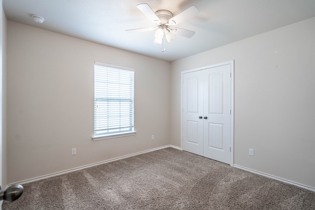 802 Wagner, Midland, TX 79707 - unfurnished bedroom featuring carpet floors, a closet, baseboards, and ceiling fan