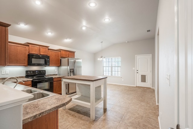 802 Wagner, Midland, TX 79707 - kitchen featuring black appliances, brown cabinets, lofted ceiling, a sink, and pendant lighting