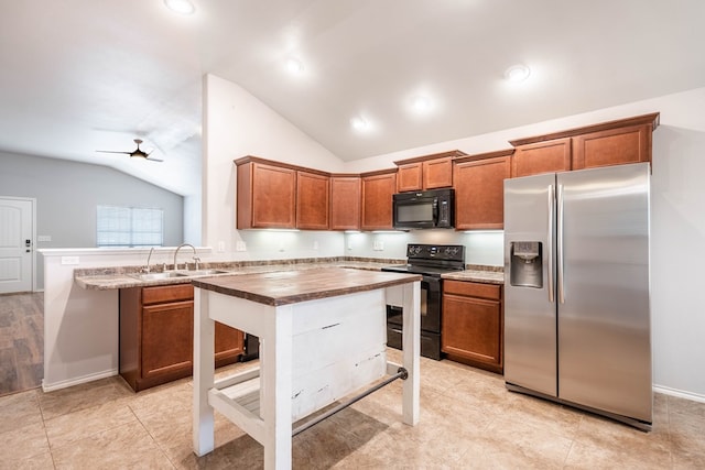 802 Wagner, Midland, TX 79707 - kitchen with black appliances, a sink, lofted ceiling, brown cabinetry, and a peninsula