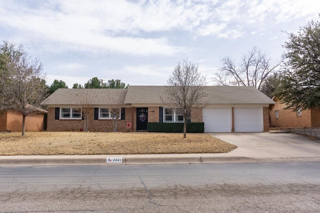 ranch-style house featuring a garage