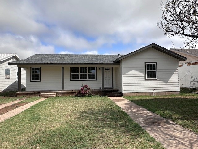 view of front of home featuring covered porch and a front yard