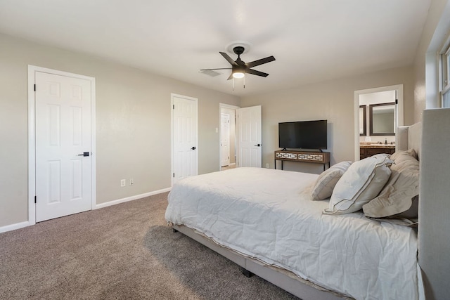 bedroom with carpet flooring, connected bathroom, and ceiling fan