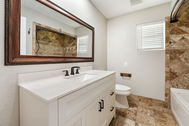 full bathroom featuring vanity, bathing tub / shower combination, and toilet