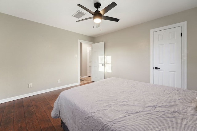 bedroom with ceiling fan and dark hardwood / wood-style floors