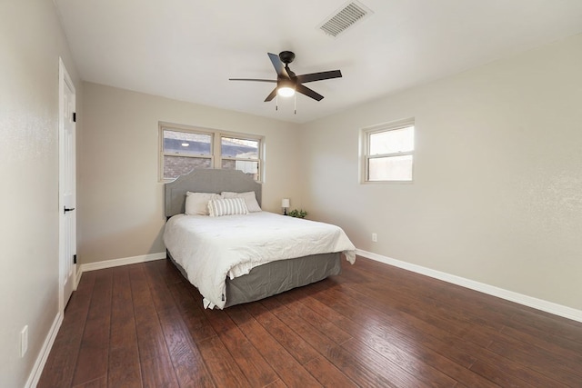 bedroom featuring ceiling fan and dark hardwood / wood-style flooring