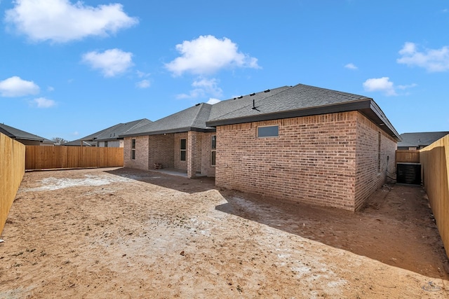 back of property featuring cooling unit and a patio area