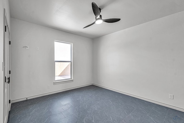 spare room with ceiling fan