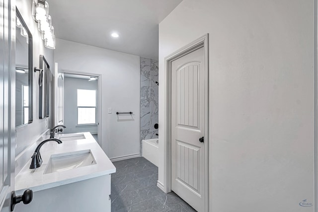 bathroom featuring vanity and shower / bathing tub combination