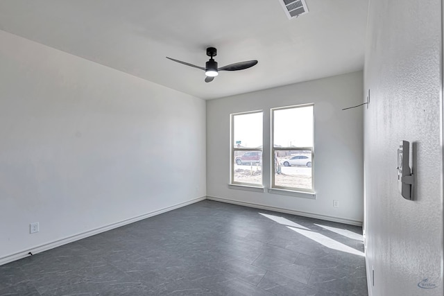 spare room with ceiling fan