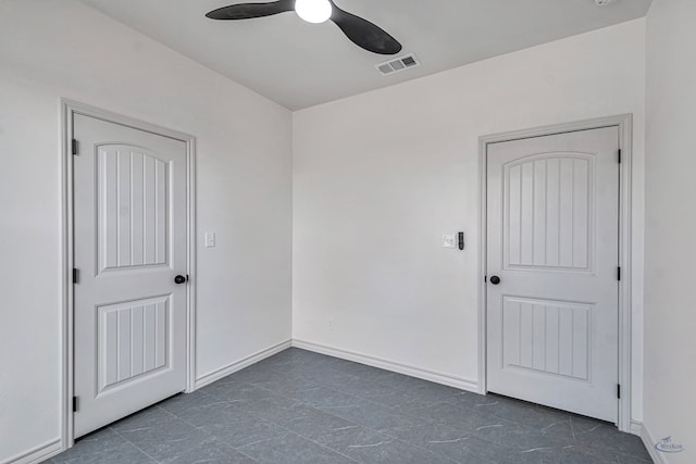 unfurnished room with ceiling fan