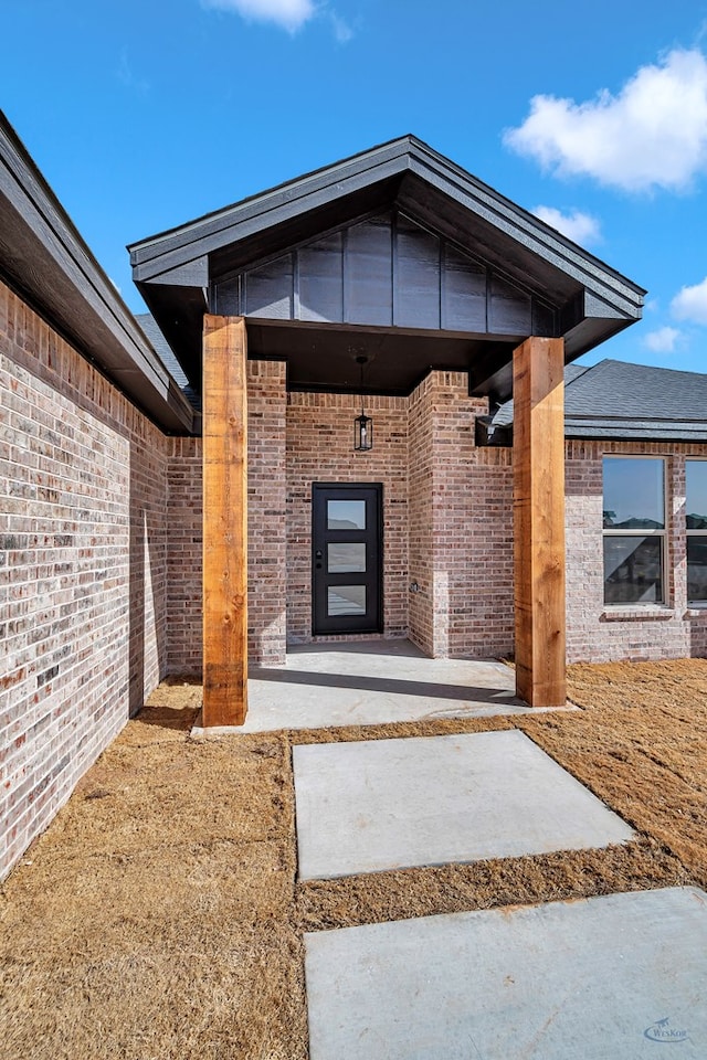 property entrance featuring a patio area