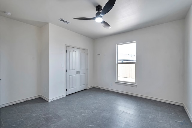 spare room featuring ceiling fan