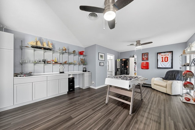 3202 Maxwell Dr, Midland, TX 79705 - living room with ceiling fan, dark wood-style flooring, bar, and vaulted ceiling