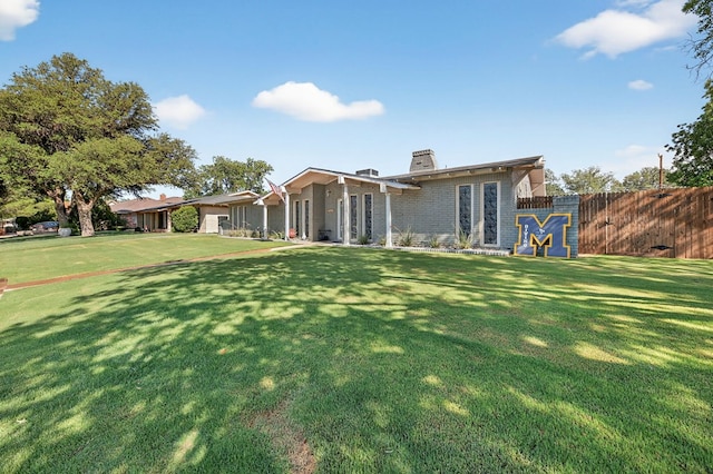 3202 Maxwell Dr, Midland, TX 79705 - back of property featuring a chimney and brick siding