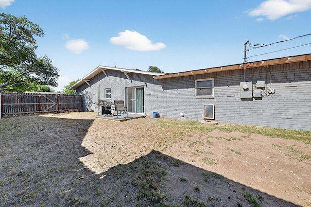 3202 Maxwell Dr, Midland, TX 79705 - rear view of property featuring brick siding