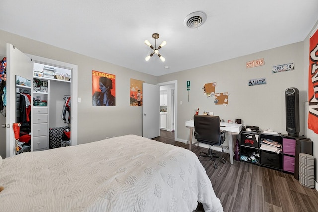 3202 Maxwell Dr, Midland, TX 79705 - bedroom featuring a chandelier, dark wood-style floors, and a desk