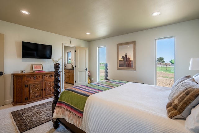 bedroom with recessed lighting, carpet flooring, and multiple windows