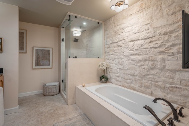 full bath featuring a garden tub, baseboards, and a shower stall
