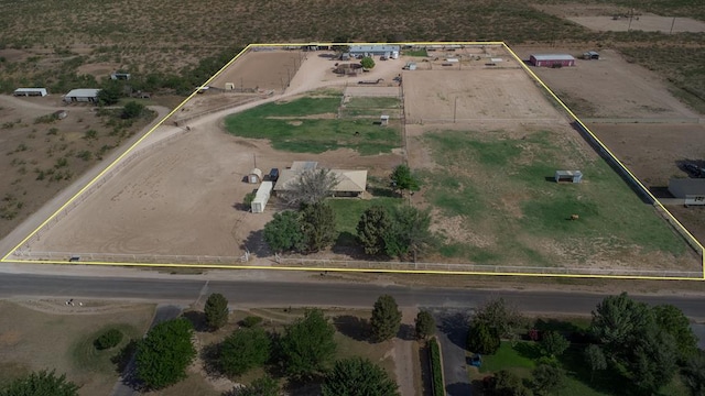 birds eye view of property featuring a rural view