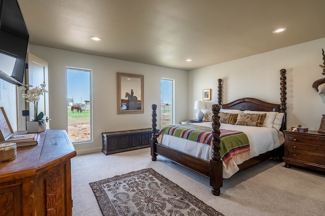 bedroom featuring carpet floors, recessed lighting, baseboards, and multiple windows