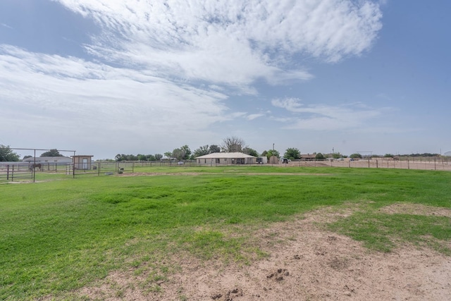 view of yard featuring fence and a rural view