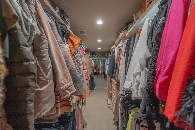 spacious closet with carpet flooring and visible vents